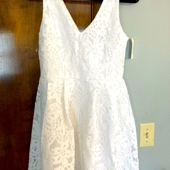Crystal Doll Dresses & Skirts - Crystal Doll Macy’s Junior laser-cut lace vneck mini dress. Size 7